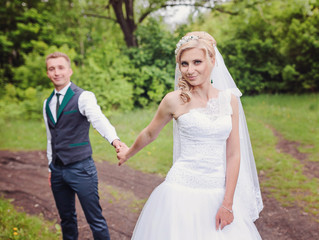 Fototapeta na wymiar Happy bride and groom on their wedding