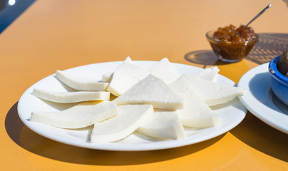 Appetizer with white goat milk cheese on plate for lunch