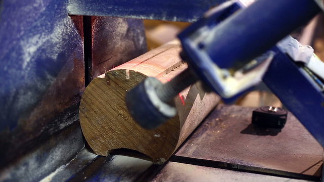 Milling machine cuts end of log at laser tag