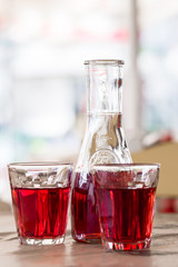 The decanter of wine and two glasses. In the tavern in Greece