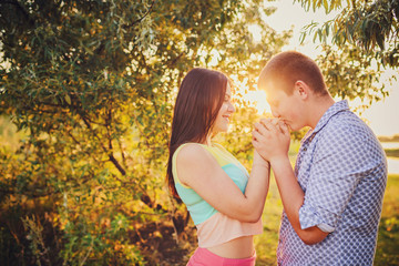 young couple in love walking in nature