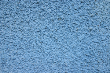 Fototapeta na wymiar rough blue stucco