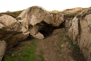 rock cave and lake