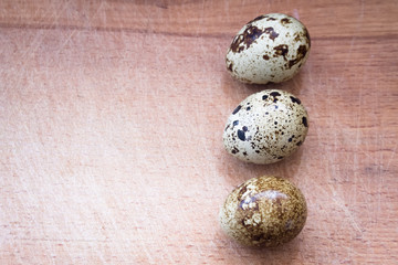 Quail eggs on wooden background 