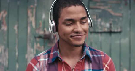 Slow Motion Portrait of mixed race man listening to music - Powered by Adobe