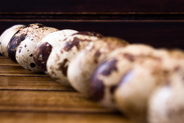 Quail eggs on wooden background 