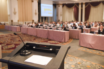 Abstract blurred people in big meeting or conference room for ba
