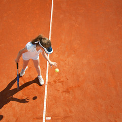 Little tennis champion preparing to serve