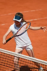 Tuinposter Junior tennis player attacking © Microgen
