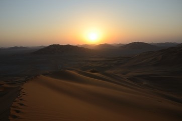 Fototapeta na wymiar Sun set in the sand dunes