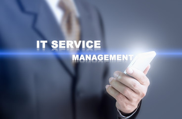 Businessman pressing hand IT service management word on virtual screen. Can bring to the medium of your ad.