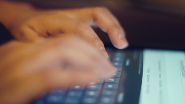 Typing hands on tablet close-up