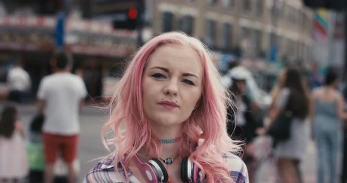Slow motion portrait of teen girl with pink hair