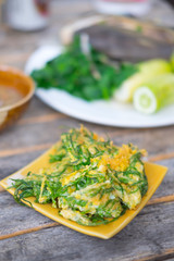 Fried acacia pennata omelet or cha-om egg