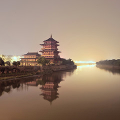 Ancient pagoda beside a quiet canal during twilight, Nanjing, China