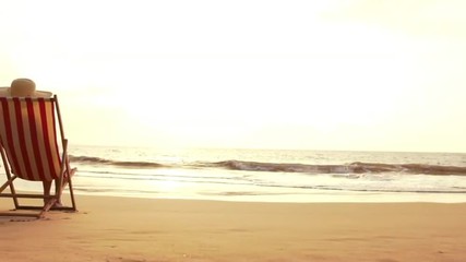 SLOW MOTION Retirement Vacation Concept, Happy Mature Retired Couple Enjoying Beautiful Sunset at the Beach
