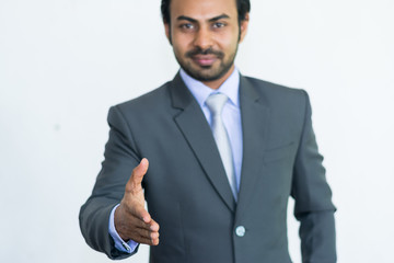 Business man wants to shake the hand and gesturing