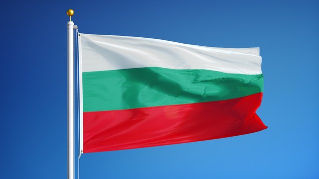 Bulgaria flag waving in slow motion against clean blue sky, seamlessly looped, close up, isolated on alpha channel with black and white luminance matte, perfect for film, news, digital composition
