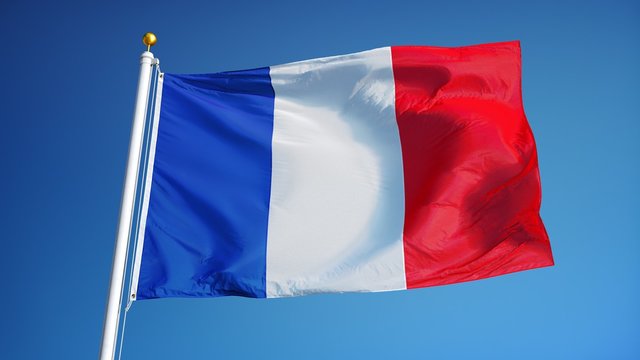 France flag waving in slow motion against clean blue sky, seamlessly looped, close up, isolated on alpha channel with black and white luminance matte, perfect for film, news, digital composition