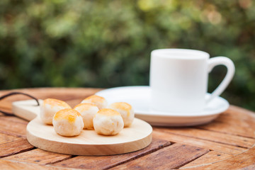 Mini Chinese cakes on wooden plate