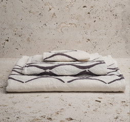 Pile of Three White Towels with Brown Concave Lines