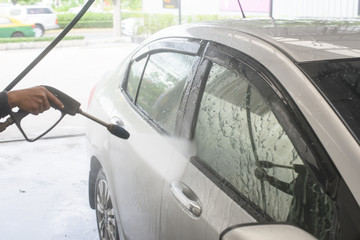 Naklejka premium car washing cleaning with foam and hi pressured water