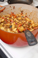 cooking pasta in a big pot on the stove