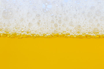 Foam and yellow beer for pattern