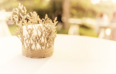 Blurred wedding flower on the table with vintage tone.