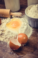 Eggs and flour on a table.