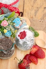 Obraz na płótnie Canvas Chia seeds with milk and fresh strawberries.