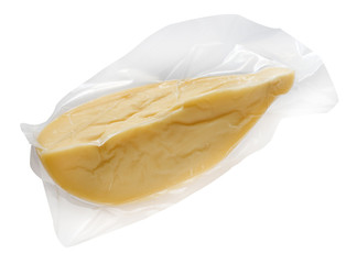 Package of yellow cheese against white background