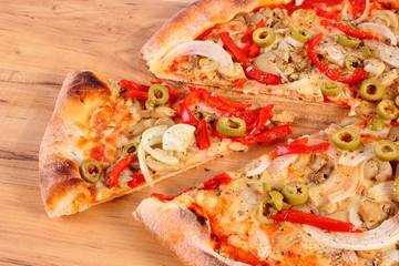 Italian vegetarian pizza on wooden surface