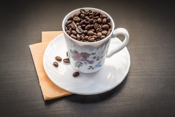 A cup with coffee beans
