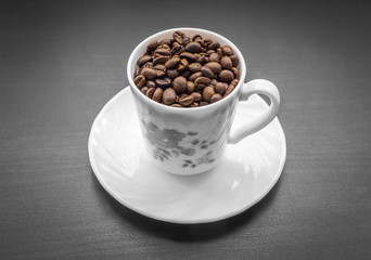 A cup with coffee beans