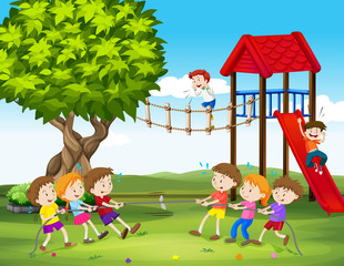 Obraz na płótnie Canvas Children playing tug of war in the playground