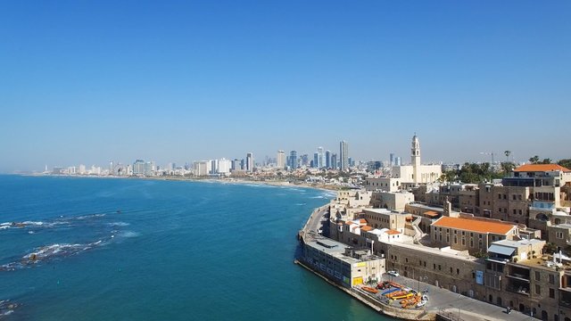 Aerial footage of the old city of Jaffa and tel Aviv skyline