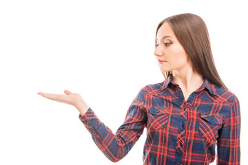 Beautiful calm young woman  gesturing and offering a product