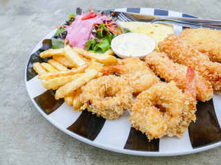 Fried seafood in plate with salad
