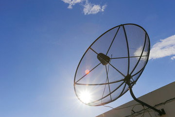 Satellite dish to the sky in blue sky background with tiny cloud