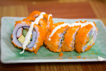 California Maki Sushi with Masago - Roll made of Crab Meat, Avoc