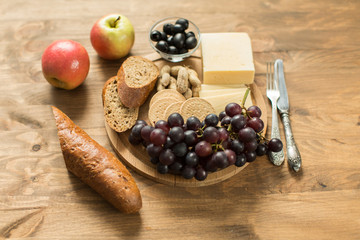 snacks for wine: cheese, raisins, baguette