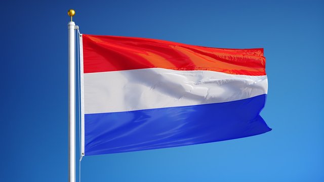 Holland flag waving in slow motion against blue sky, seamlessly looped, close up, isolated on alpha channel with black and white luminance matte, perfect for film, news, digital composition