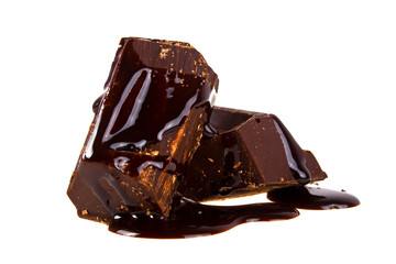 Slices dark chocolate bar poured chocolate isolated on white bac