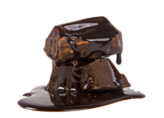 Slices dark chocolate bar poured chocolate isolated on white bac