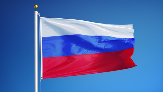 Russia flag waving in slow motion against blue sky, seamlessly looped, close up, isolated on alpha channel with black and white luminance matte, perfect for film, news, digital composition