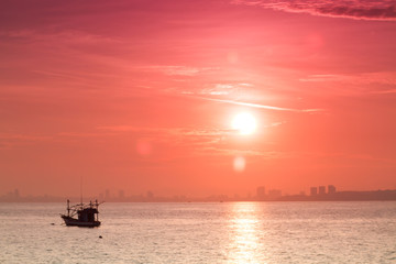 Naklejka na ściany i meble abstract sunrise in the sea view of sea ship near the town at as
