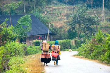 Hmong women are on the path to their village in Sapa, Vietnam.