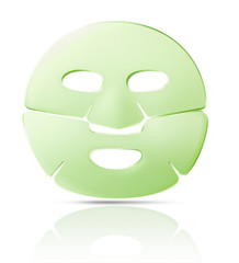 Green facial sheet mask with shadow, isolated on white background.
