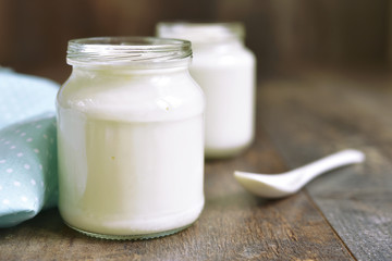 Obraz na płótnie Canvas Homemade yogurt in a glass jar.
